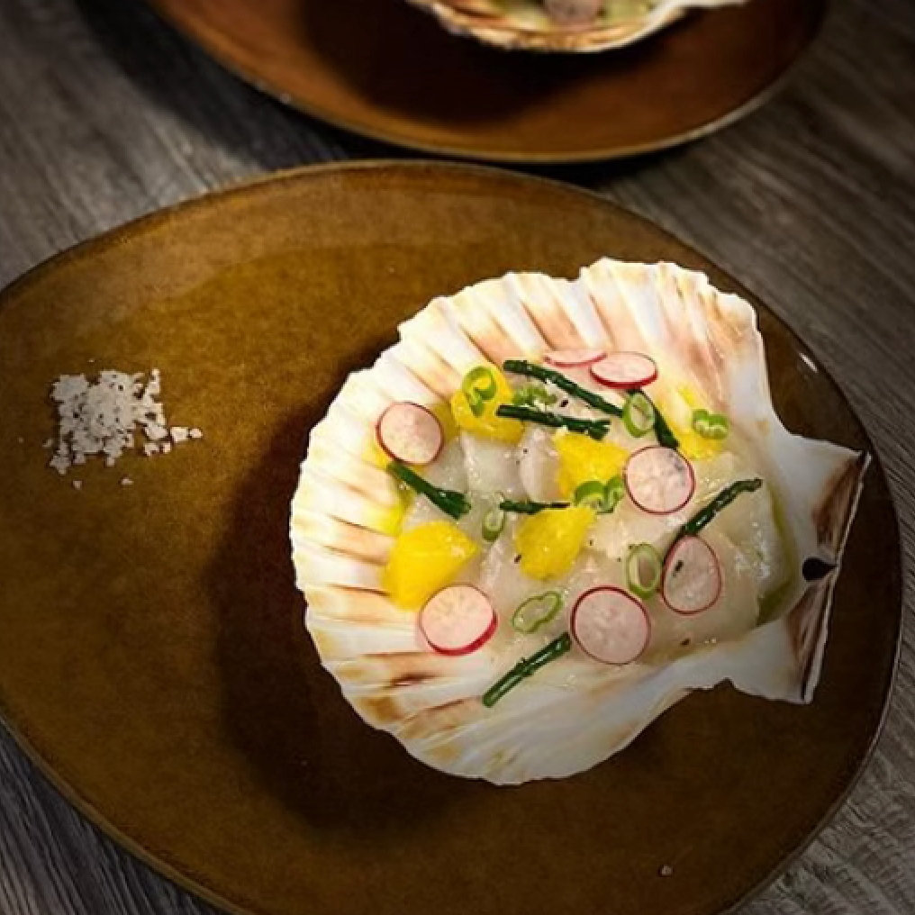 Carpaccio of saint jaques avocado citrus fruits and Bora Bora salt with vanilla.